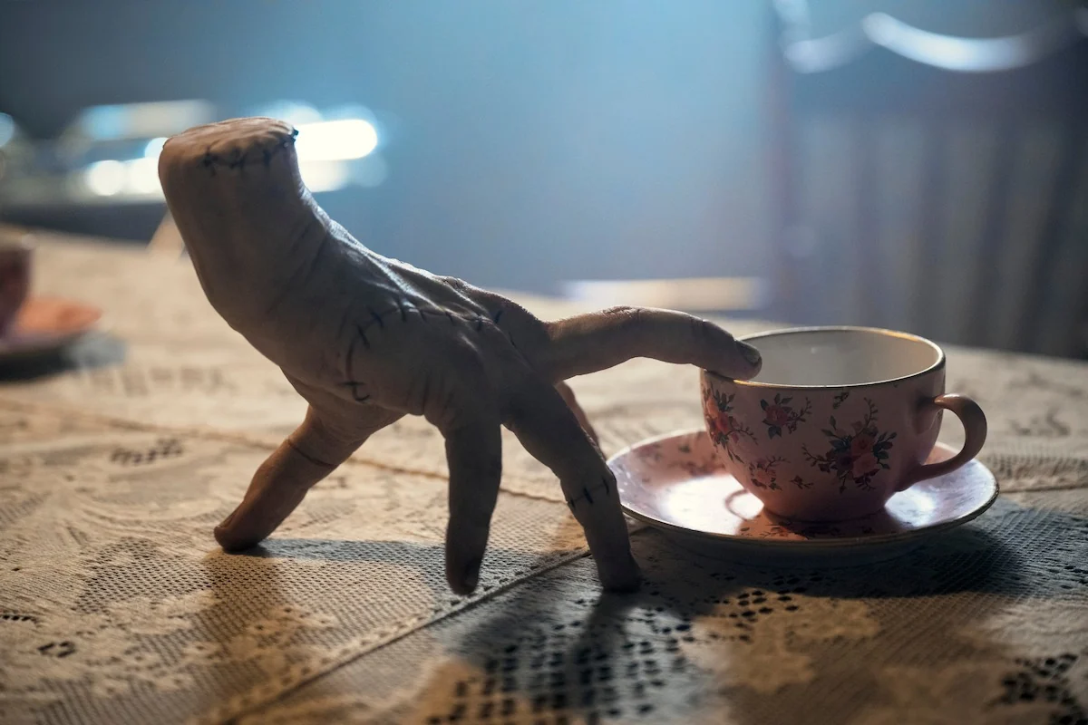 Victor Dorobantu as Thing in a Season 2 portrait for Wednesday on Netflix