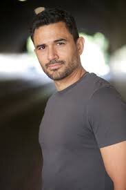 Ivan Hernandez as Alec Bloom in Elsbeth Ivan Hernandez as Alec Bloom in Elsbeth