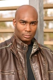 Michasha Armstrong as Coach Marty Perez in Tracker